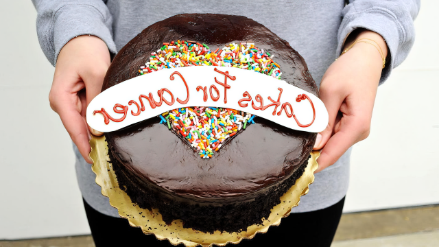 Cakes for Cancer founder Abigail Nathanon holding cake