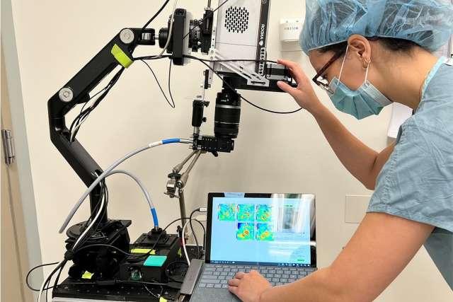 A UCLA Health resident operates a DOCI device in the lab.