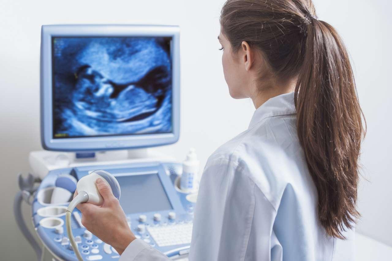 Female Doctor Performing Ultrasound