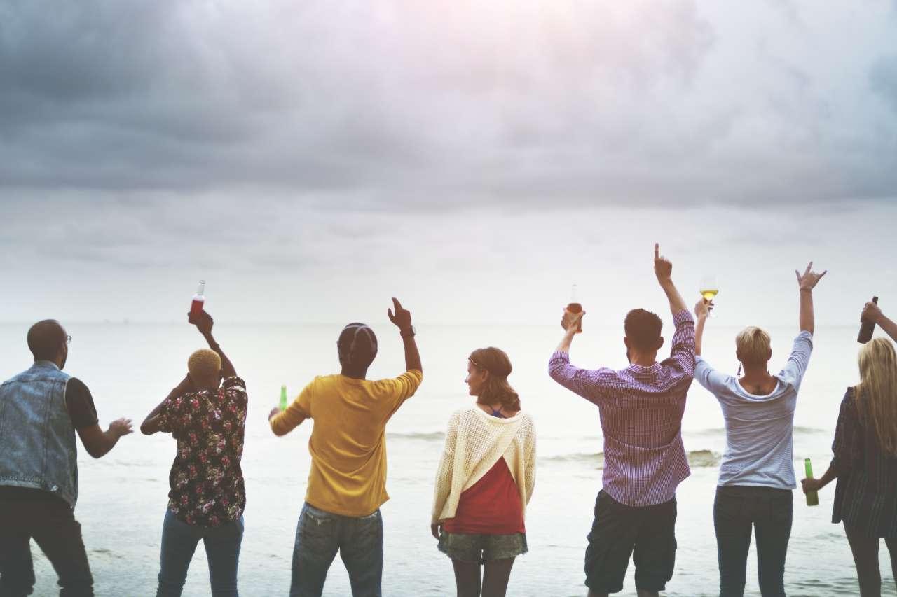 Cancer patients standing together on the beach